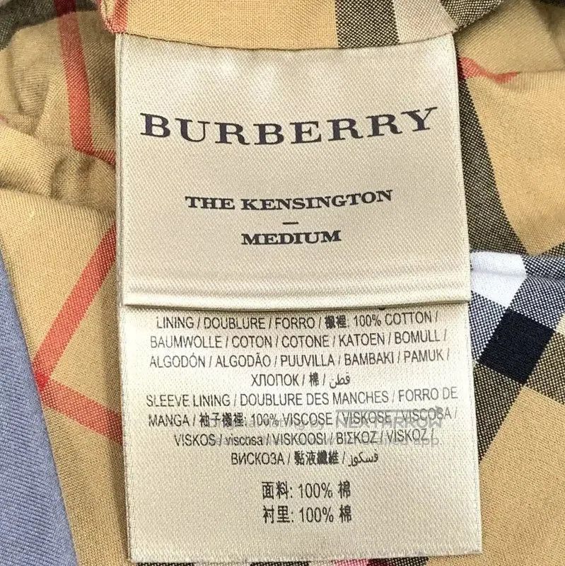 Burberry Women's Dark Blue Cotton Trench Coat.