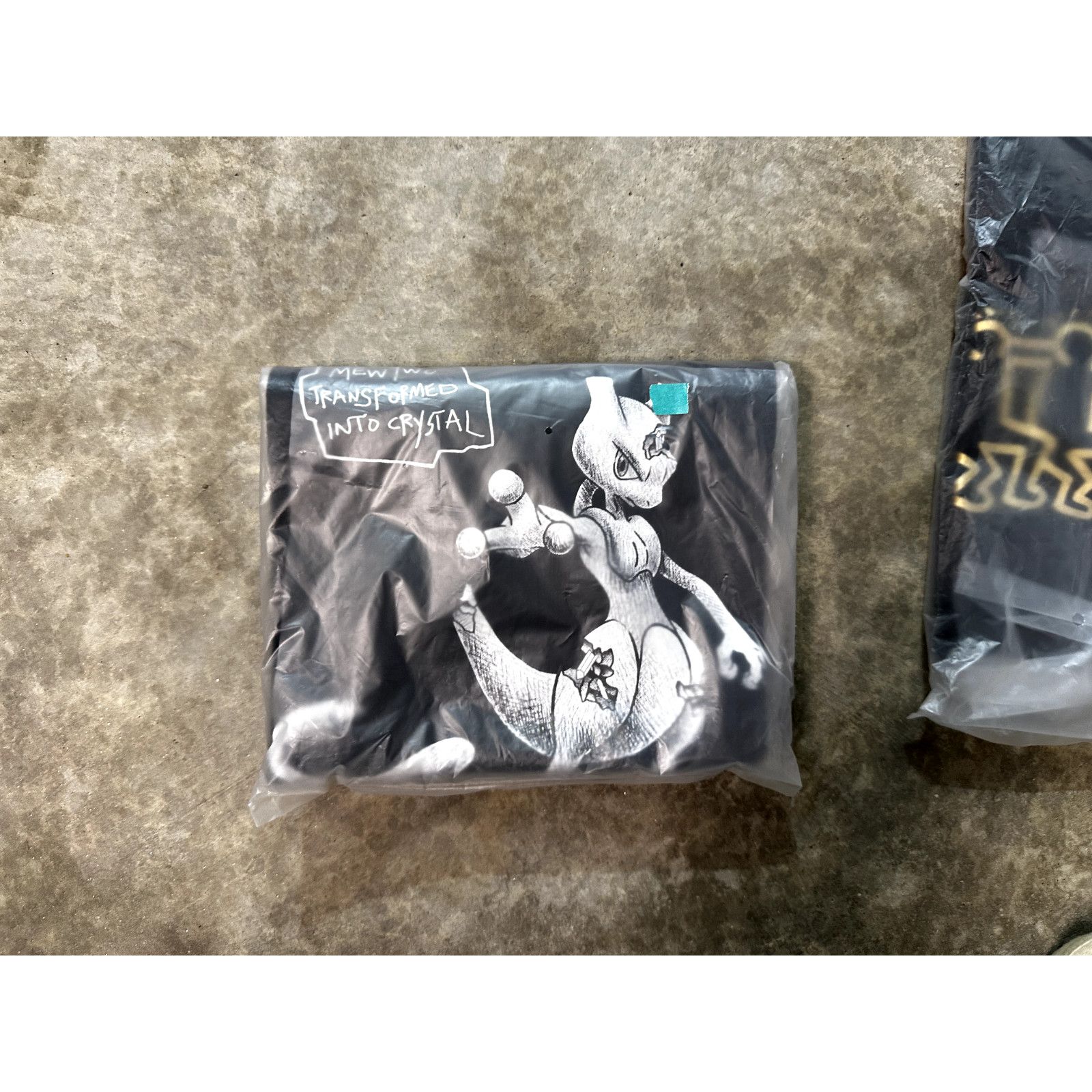 Daniel Arsham Daniel Arsham x Pokémon Mewtwo | Medium | UT Graphic | New Size US M / EU 48-50 / 2 - 5 Thumbnail