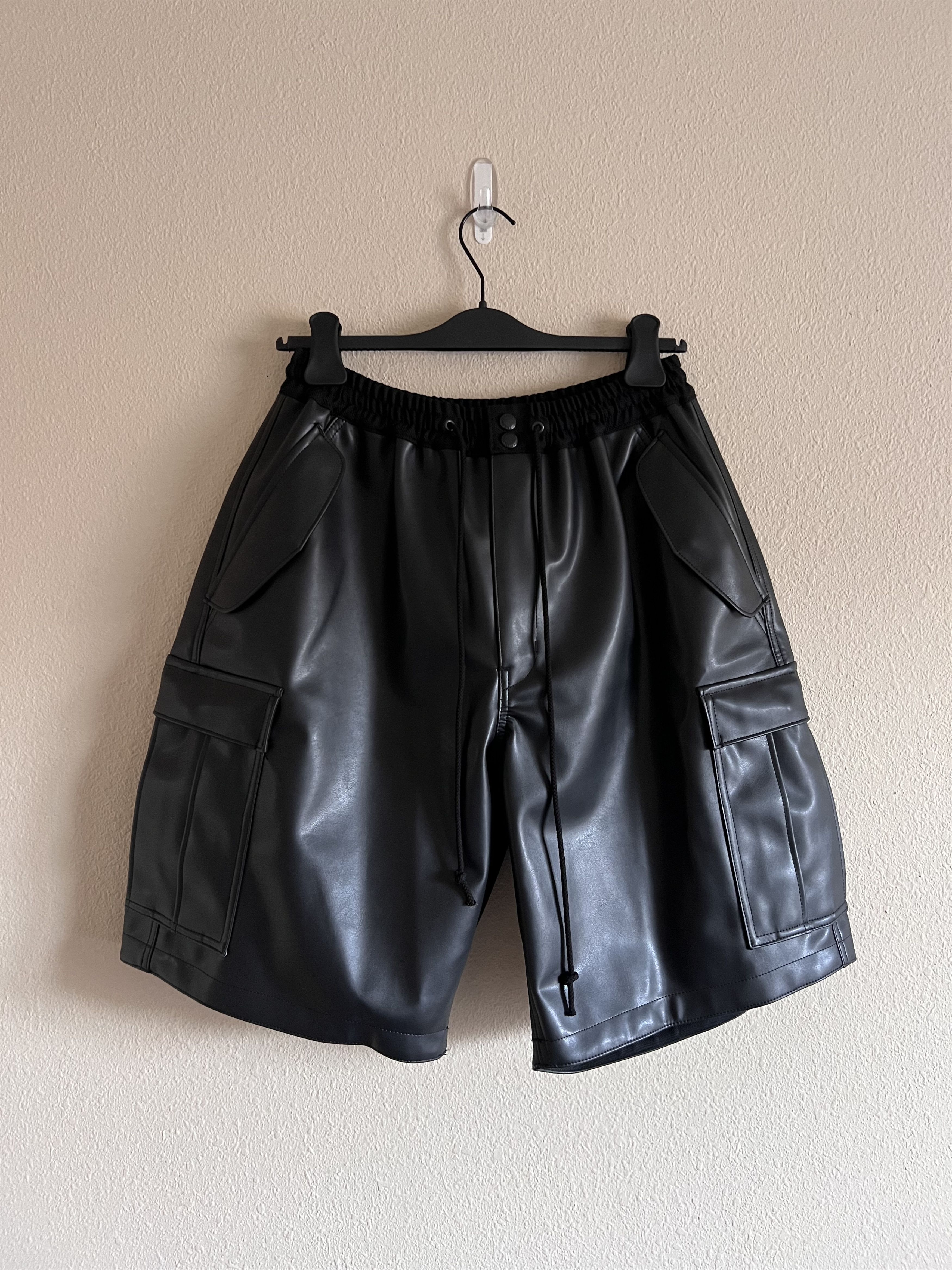image of Junya Watanabe Faux Leather Cargo Shorts In Black, Men's (Size 32)