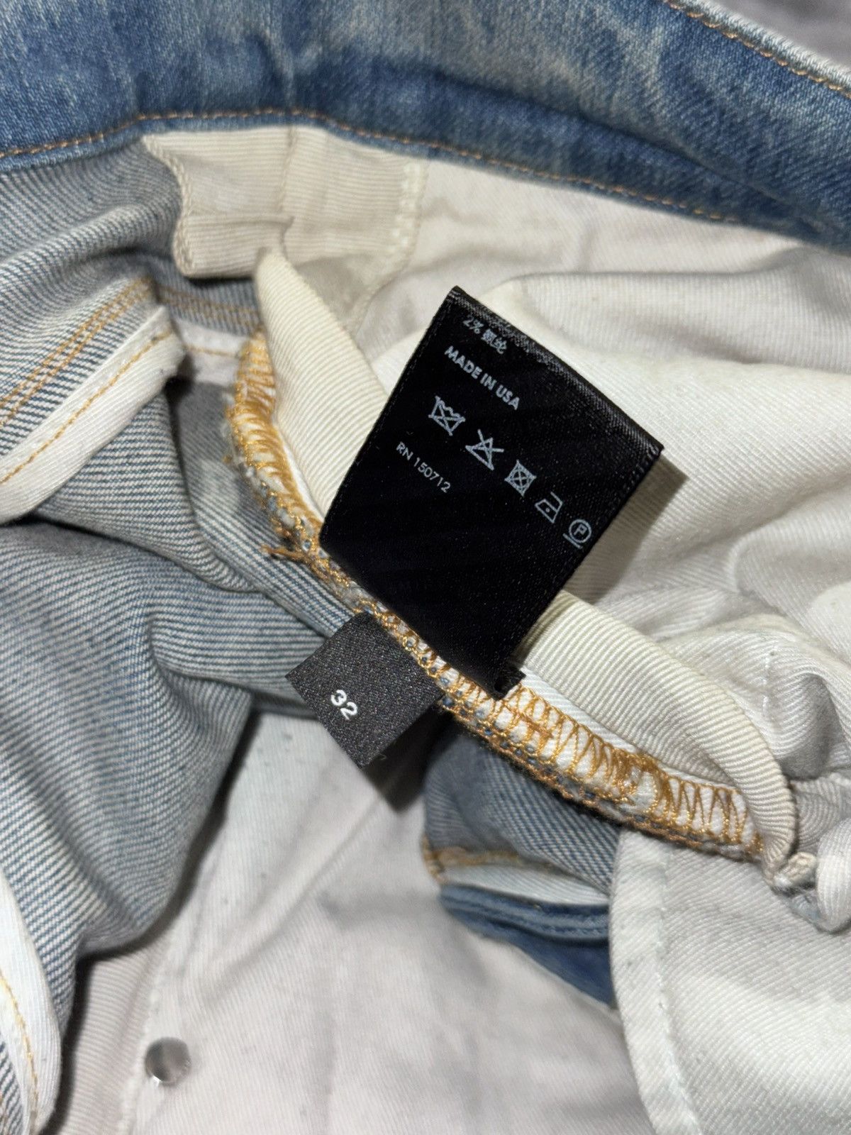 AMIRI BLUE DISTRESSED JEANS