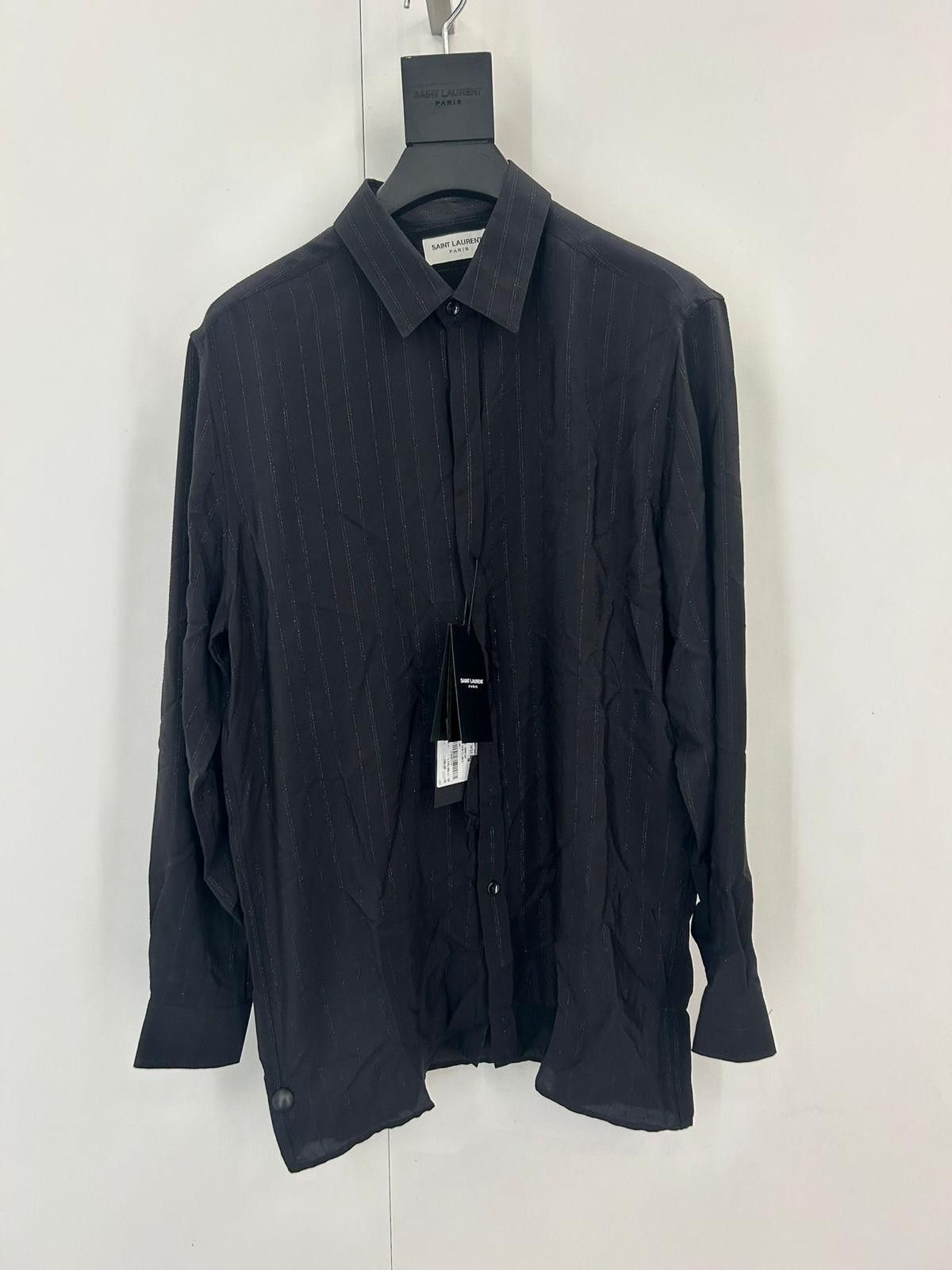 buttoned shirt with a pointed collar.