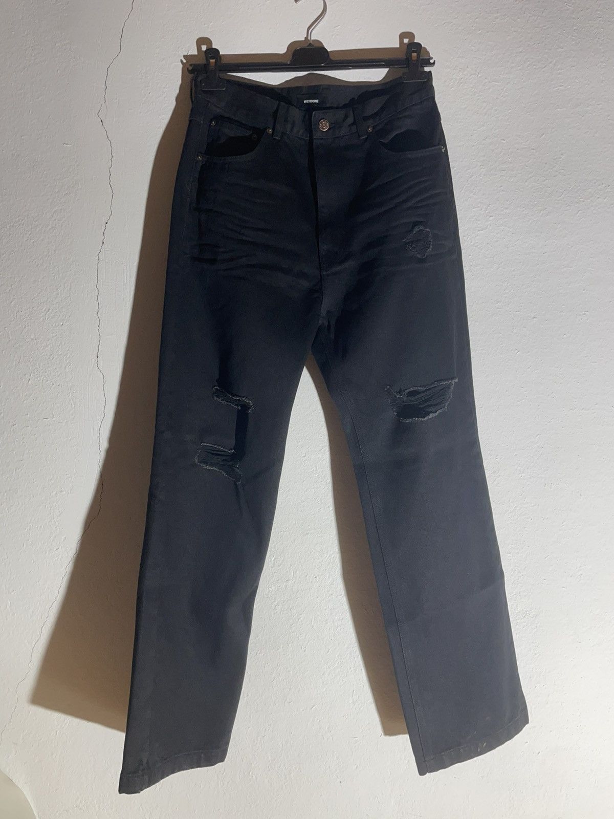 WE11DONE black distressed jeans