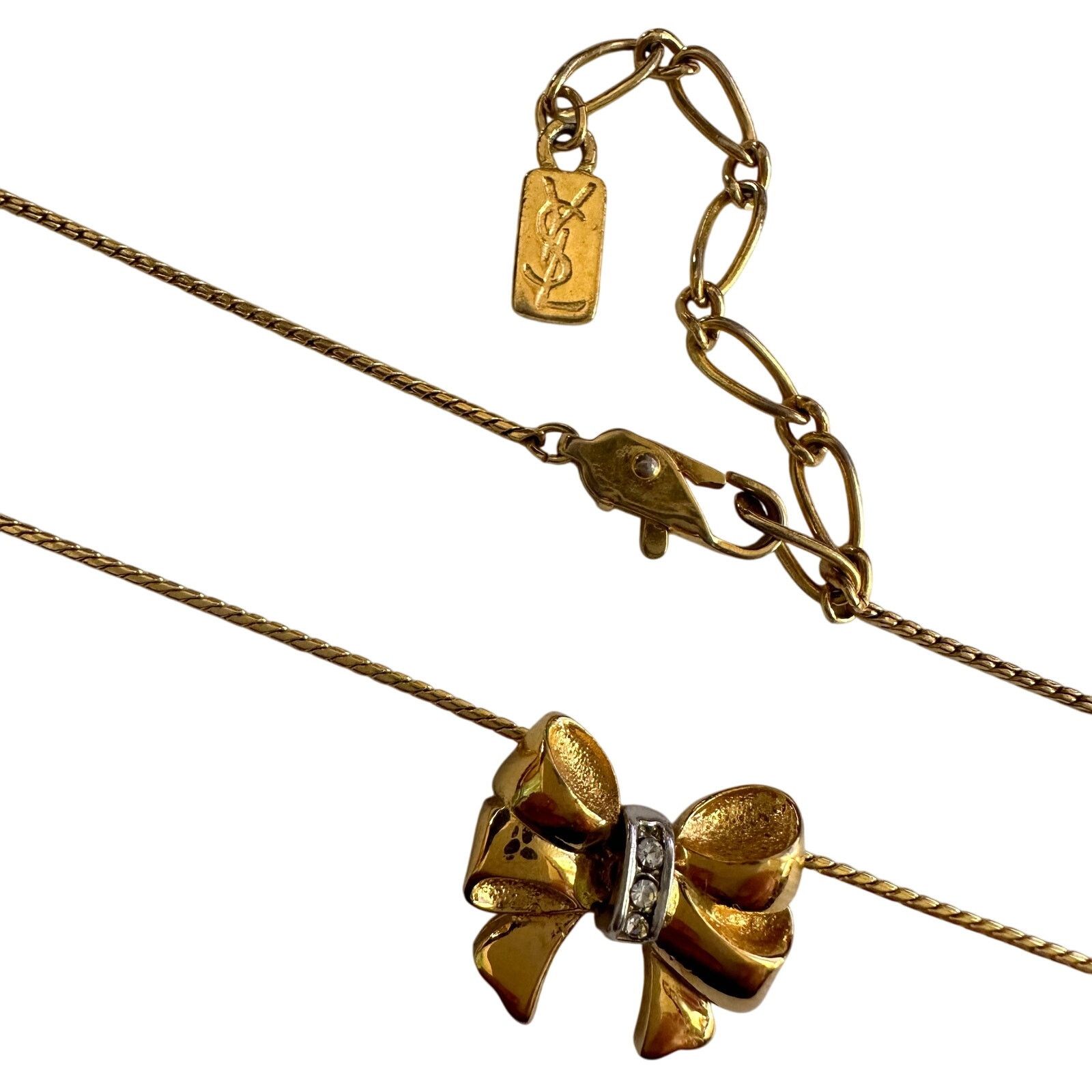 Yves Saint Laurent Yves Saint Laurent Gold and Rhinestone Bow Necklace Size ONE SIZE - 10 Thumbnail