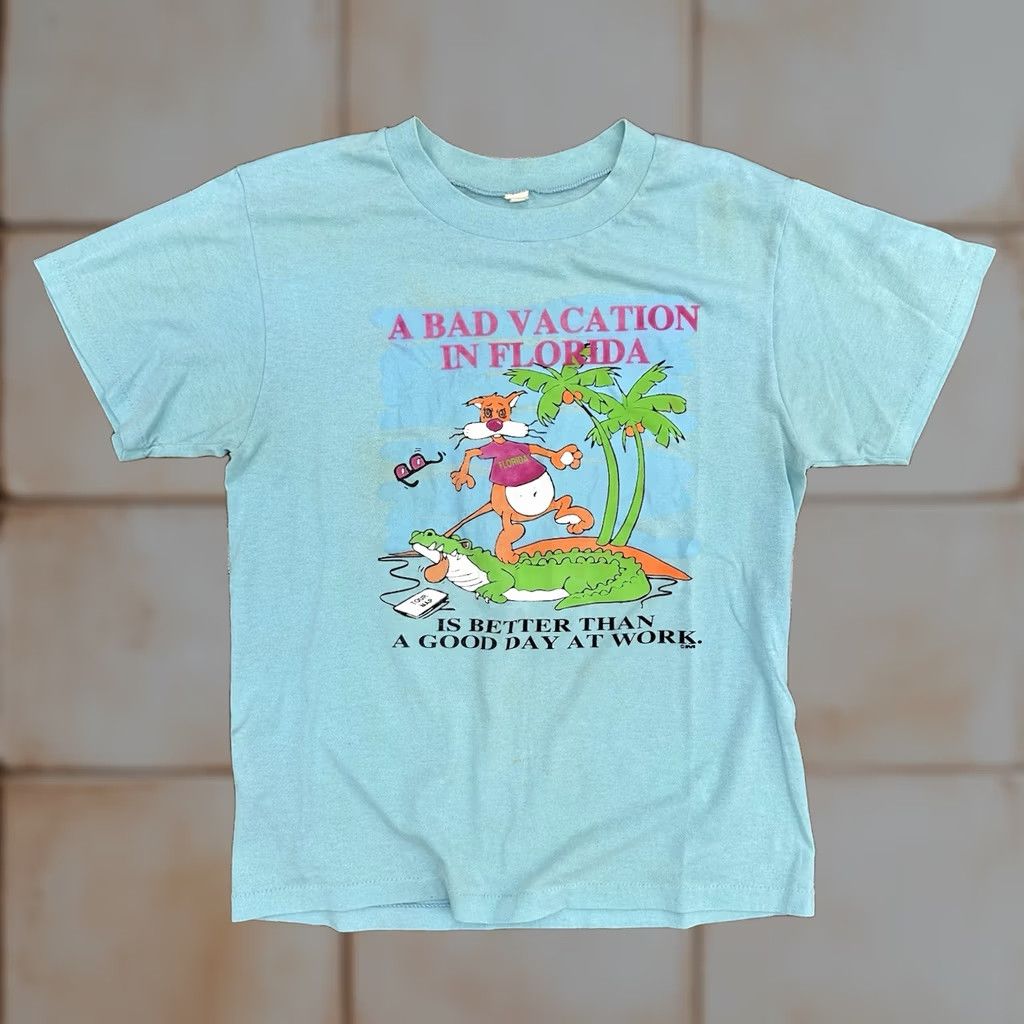 Vintage VINTAGE 80s A Bad Vacation In Florida Graphic T Shirt Blue Distressed Large Men Short Sleeve Crew Neck 1980s 80s Florida Shirt Size US L / EU 52-54 / 3 - 1 Thumbnail