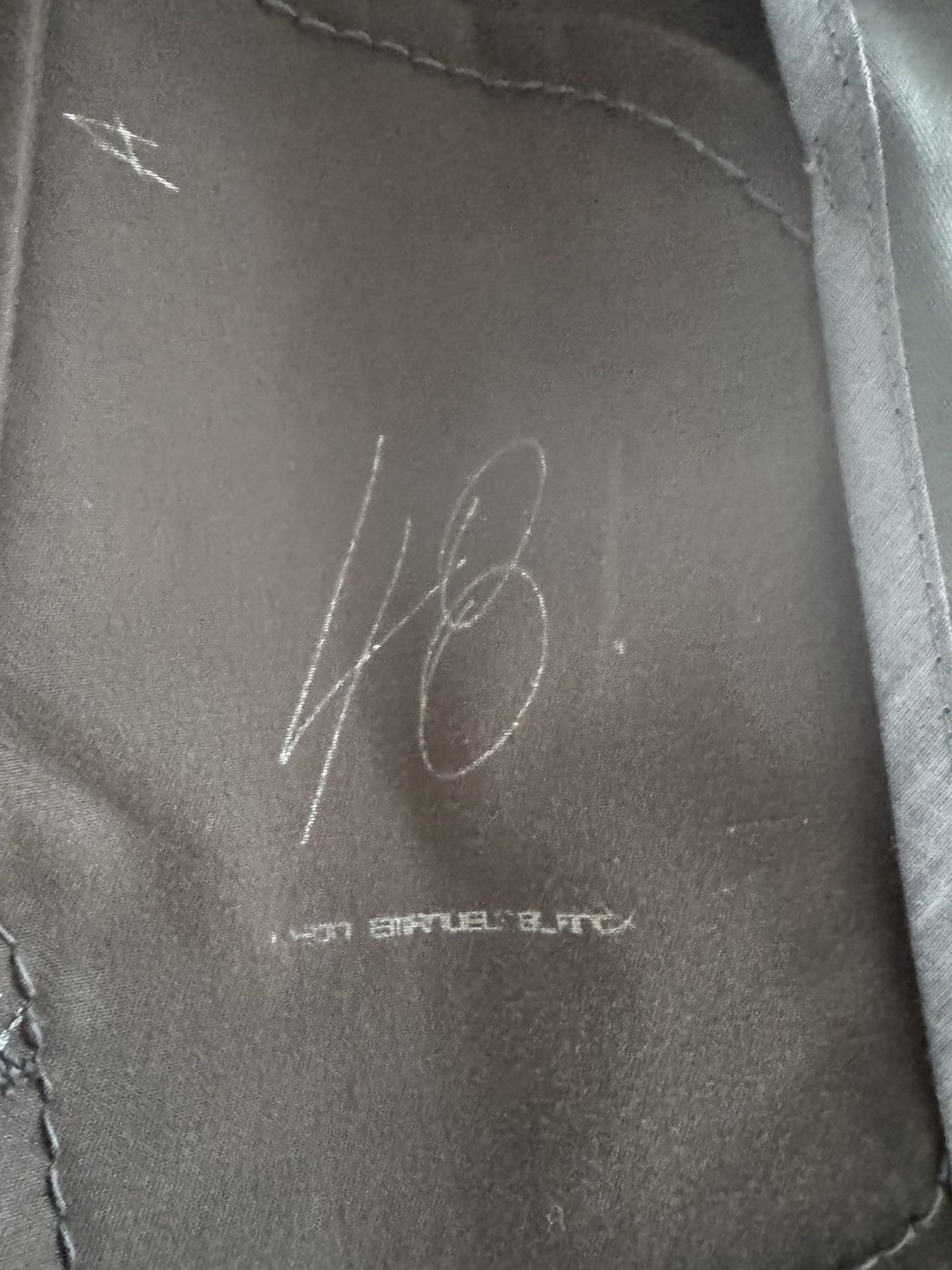 Unlined hand stitched hooded jacket.