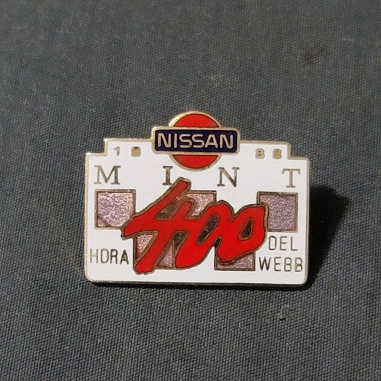 The Unbranded Brand Vtg 1988 Mint 400 Nissan HDRA Del Webb Lapel Pin Size ONE SIZE - 1 Thumbnail