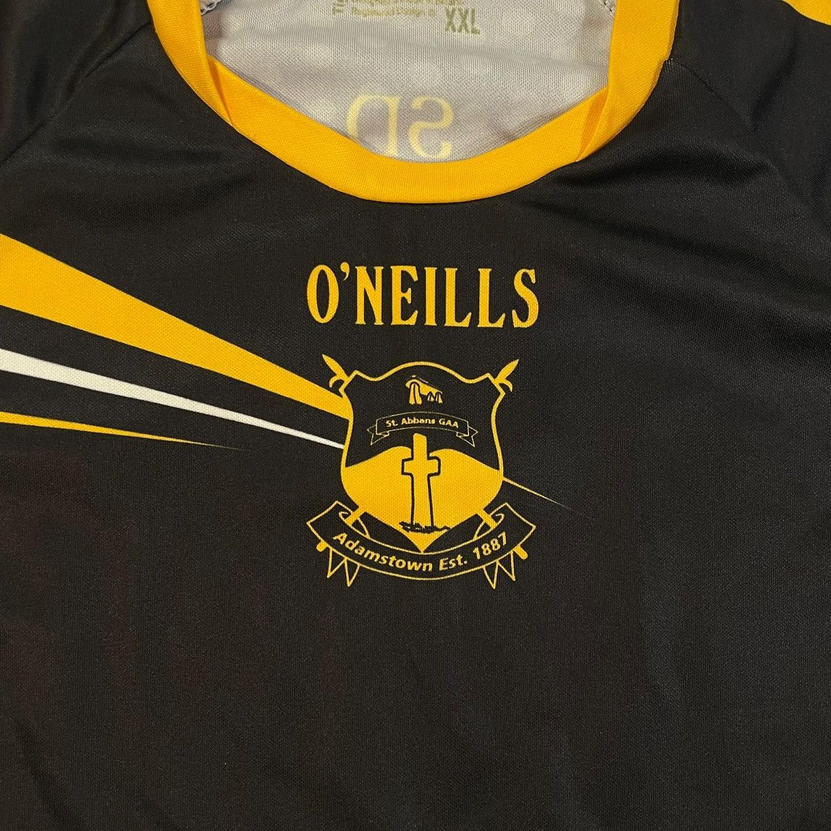 O'Neill Black and yellow O'Neills Adamstown GAA jersey shirt tee Size US XXL / EU 58 / 5 - 6 Thumbnail