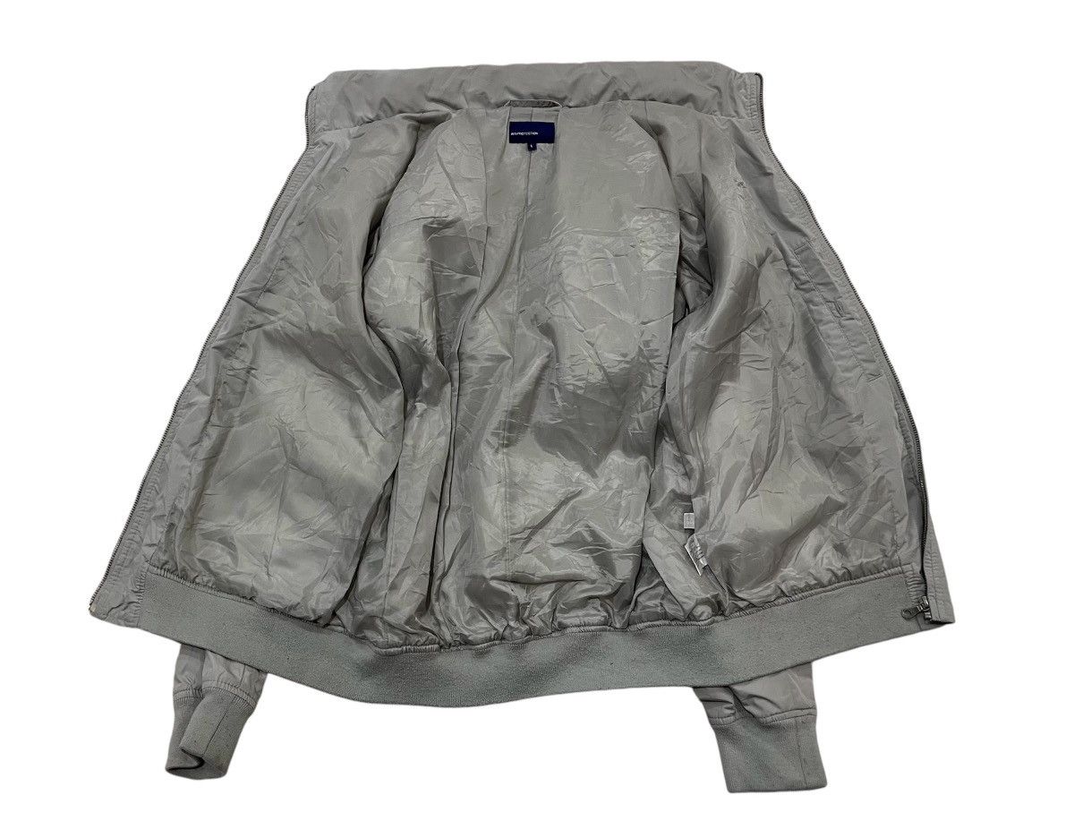 Uniqlo Vintage Uniglo Air Protection Windbreaker Hooded Jacket Size US L / EU 52-54 / 3 - 7 Thumbnail