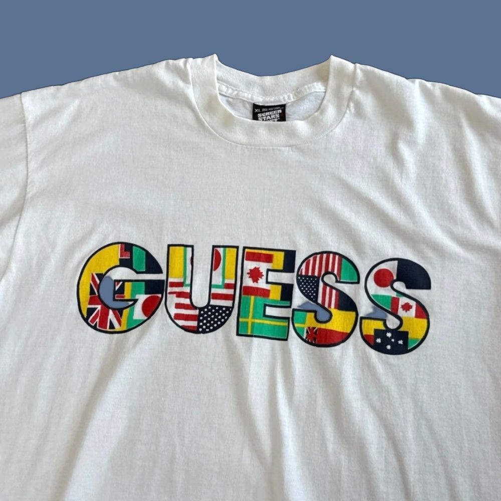 Vintage VINTAGE Guess Nations Flags T-Shirt Large Men 90s White Short Sleeve World Flags 1990s Size US L / EU 52-54 / 3 - 1 Thumbnail