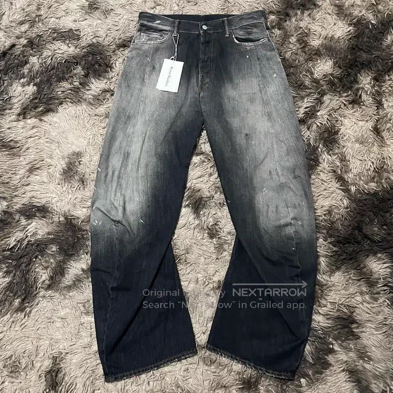 Acne Studios Black ink-splattered curved knife jeans