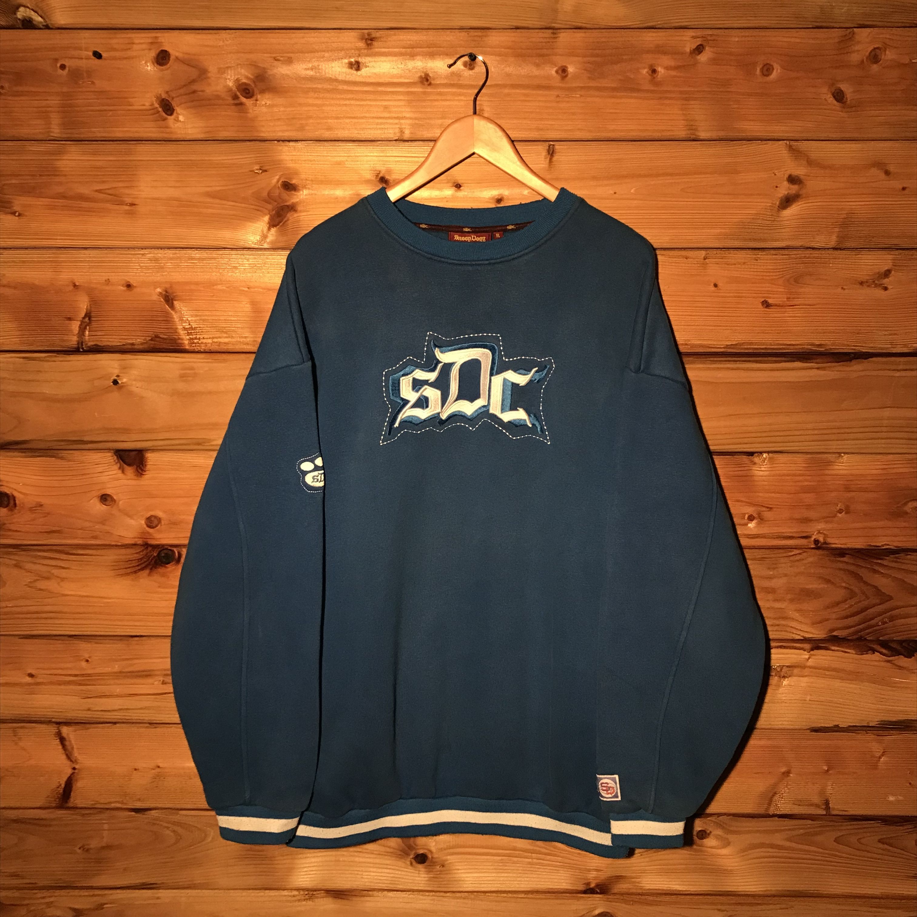 image of Rap Tees x Snoop Dogg 90's Snoop Dogg Clothing Company Sdc Spellout Sweatshirt in Blue (Size XL)