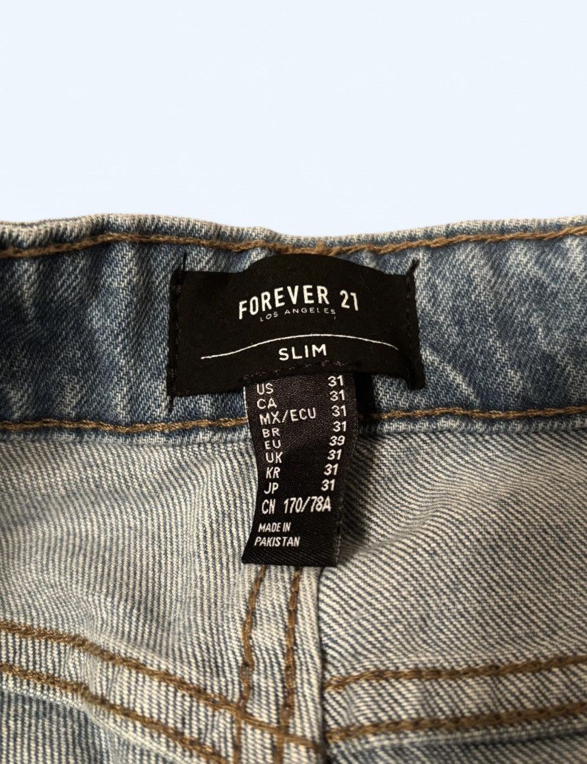Forever 21 Blue distressed slim jeans with ripped knees size 31 Size US 31 - 4 Thumbnail