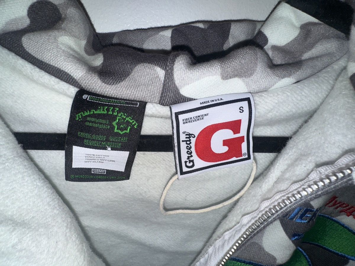 Greedy Unit × murd333r.fm Greedy Unit x Murd333r.fm Camo Multi Tag Size US S / EU 44-46 / 1 - 2 Thumbnail