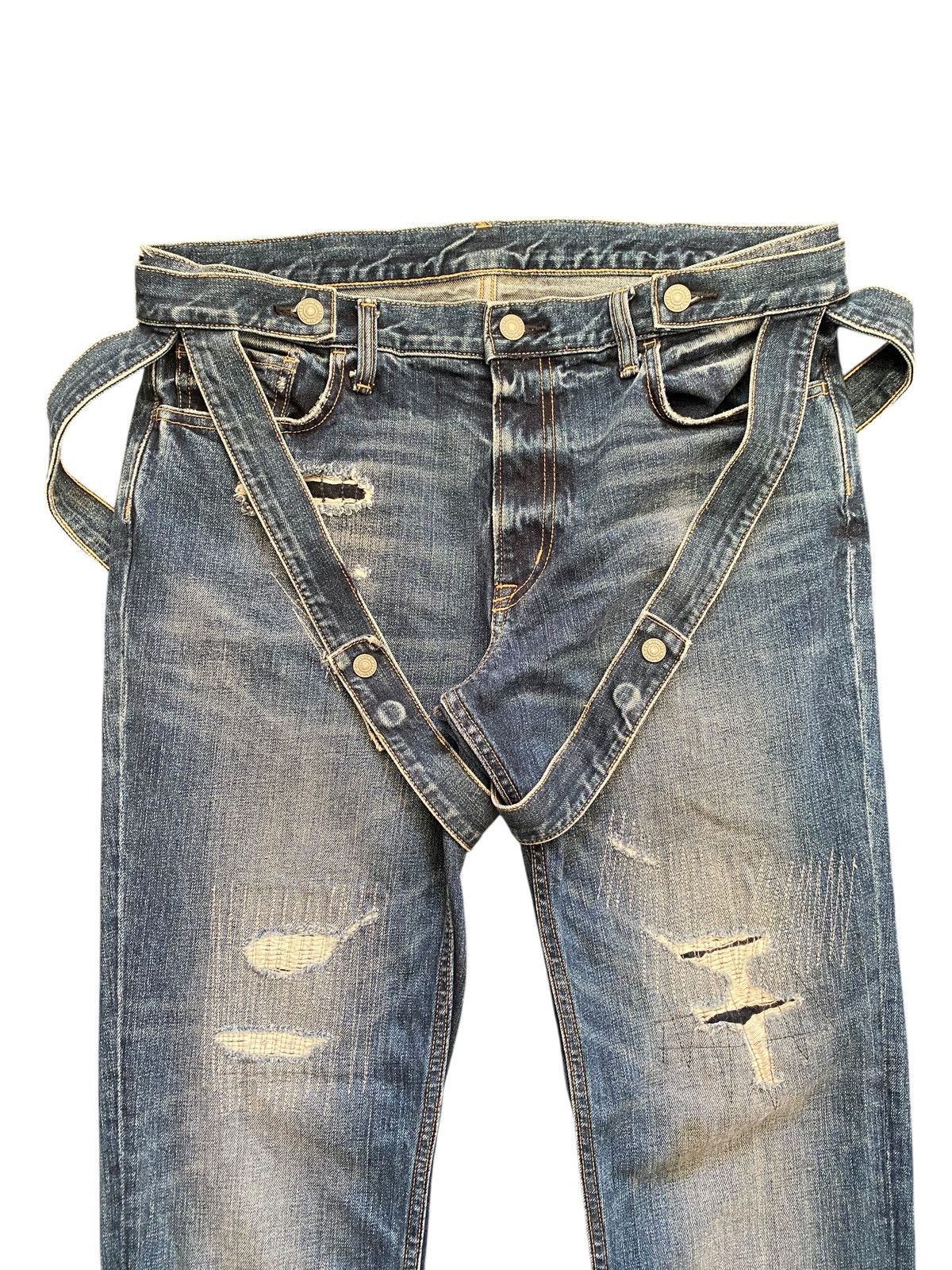 Kim Jones x GU distressed bondage denim