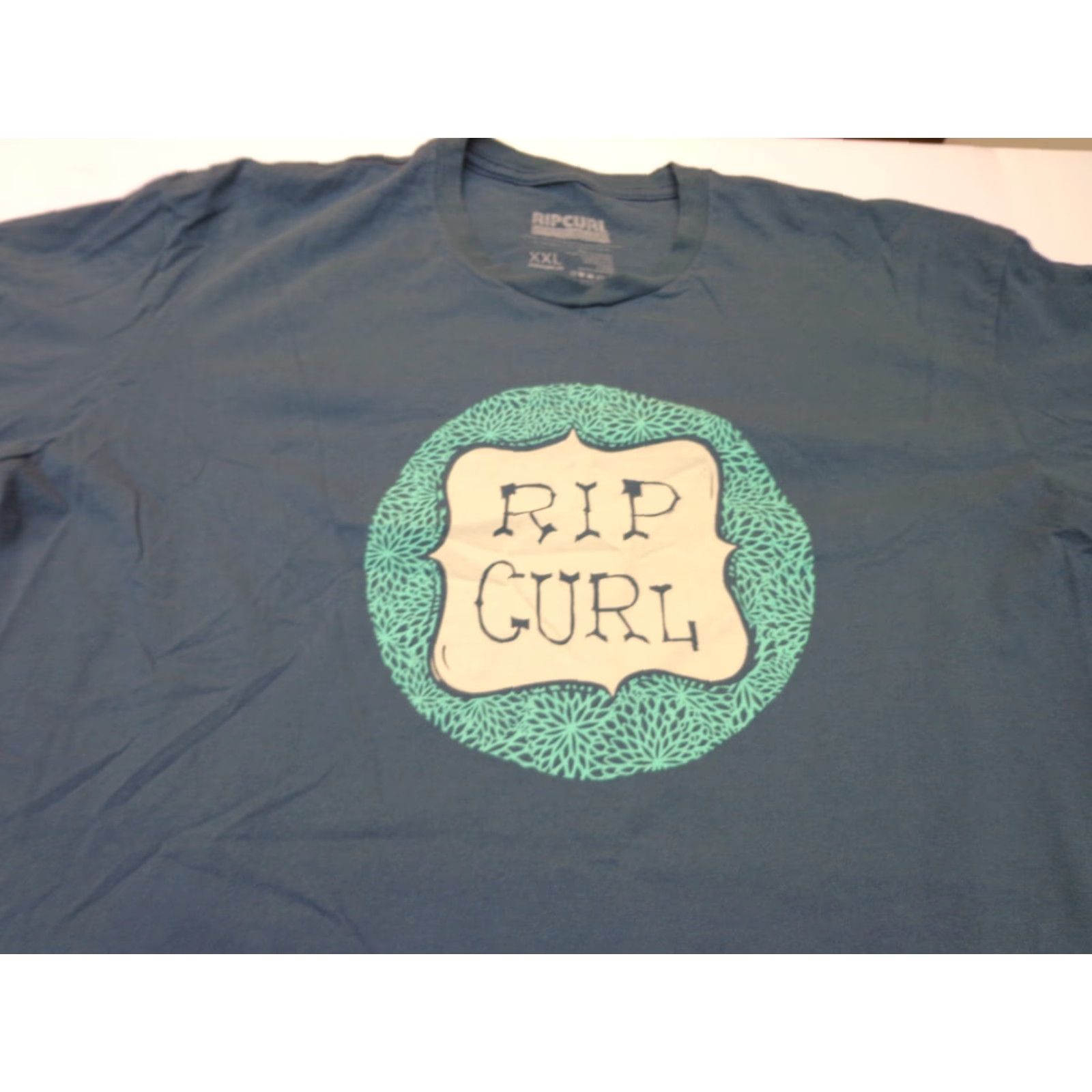 Rip Curl Rip Curl T-Shirt Blue 2XL Relaxed Fit Crew Neck Short Sleeve Graphic Print Men's Regular USA Mexico Summer Spring Fall “A Product Of The Search” Size US XXL / EU 58 / 5 - 2 Thumbnail