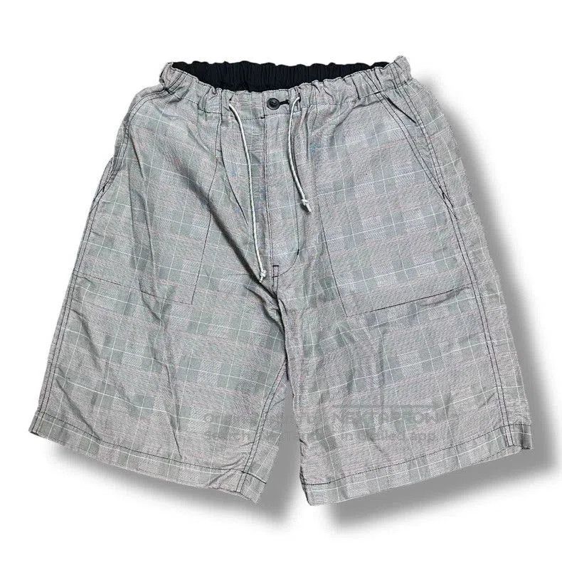 COMME des GARCONS HOMME Plaid Shorts.