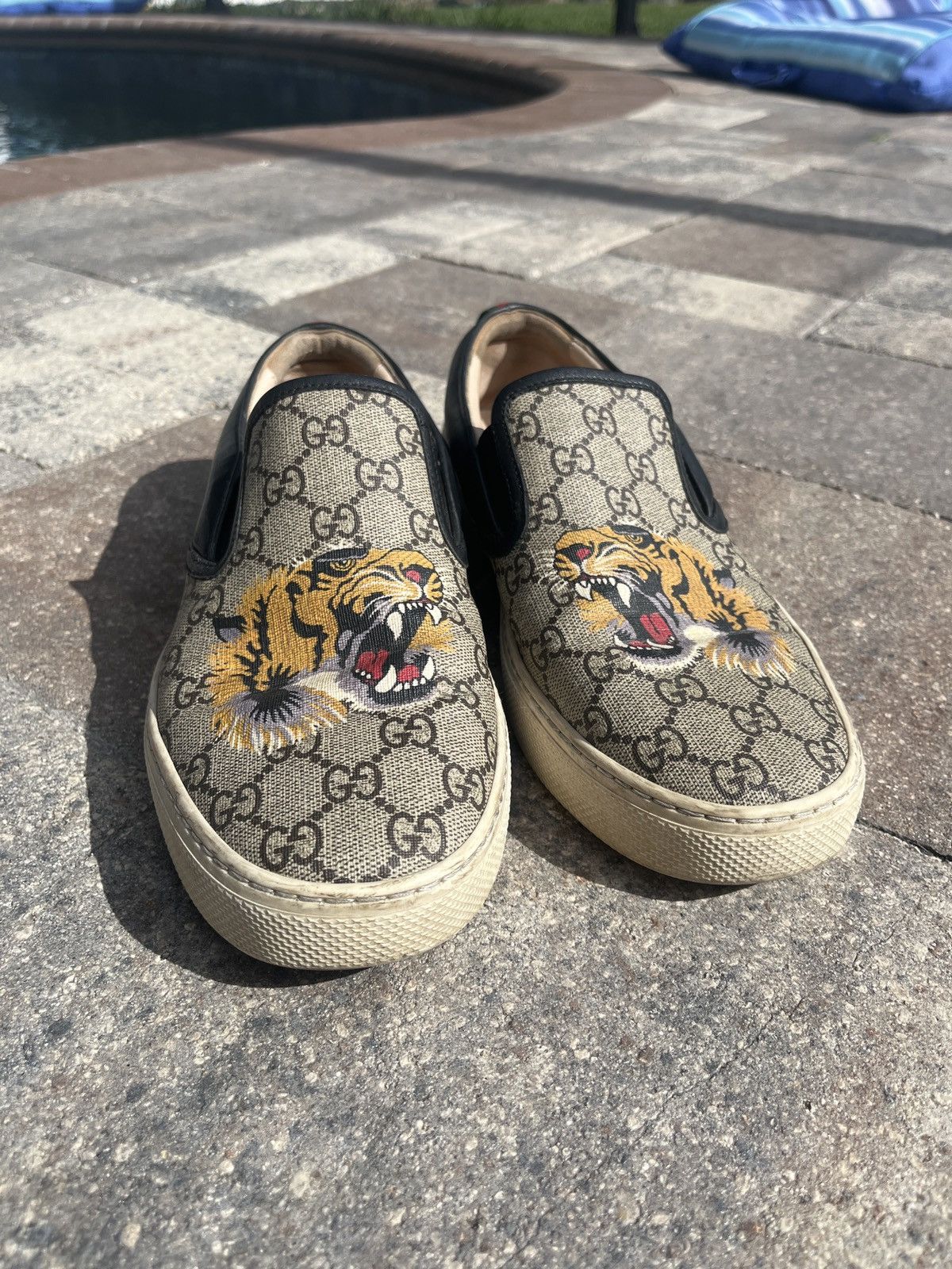 Gucci tiger slip store ons