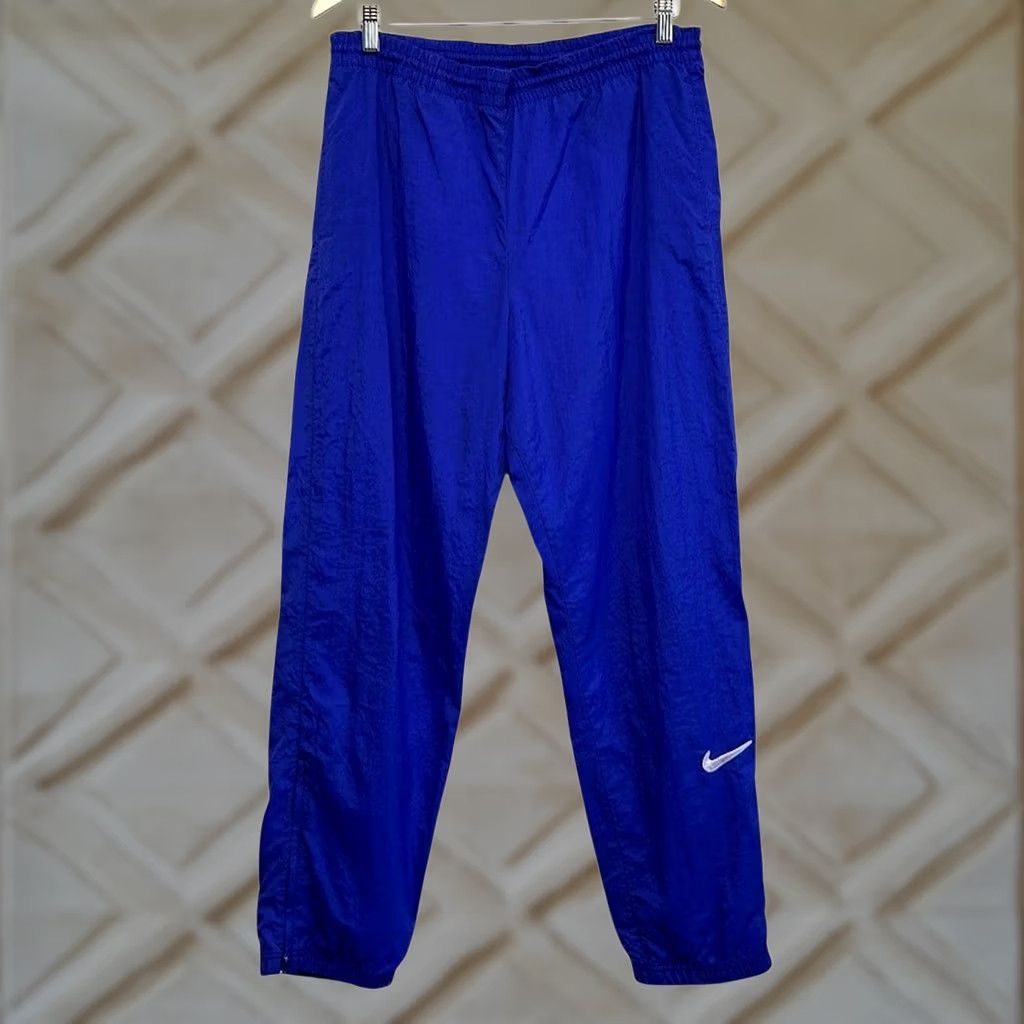 Nike VINTAGE Nike Track Pants M Blue Nylon Windbreaker Ankle Zip Embroidered Swoosh Size US 31 - 1 Thumbnail