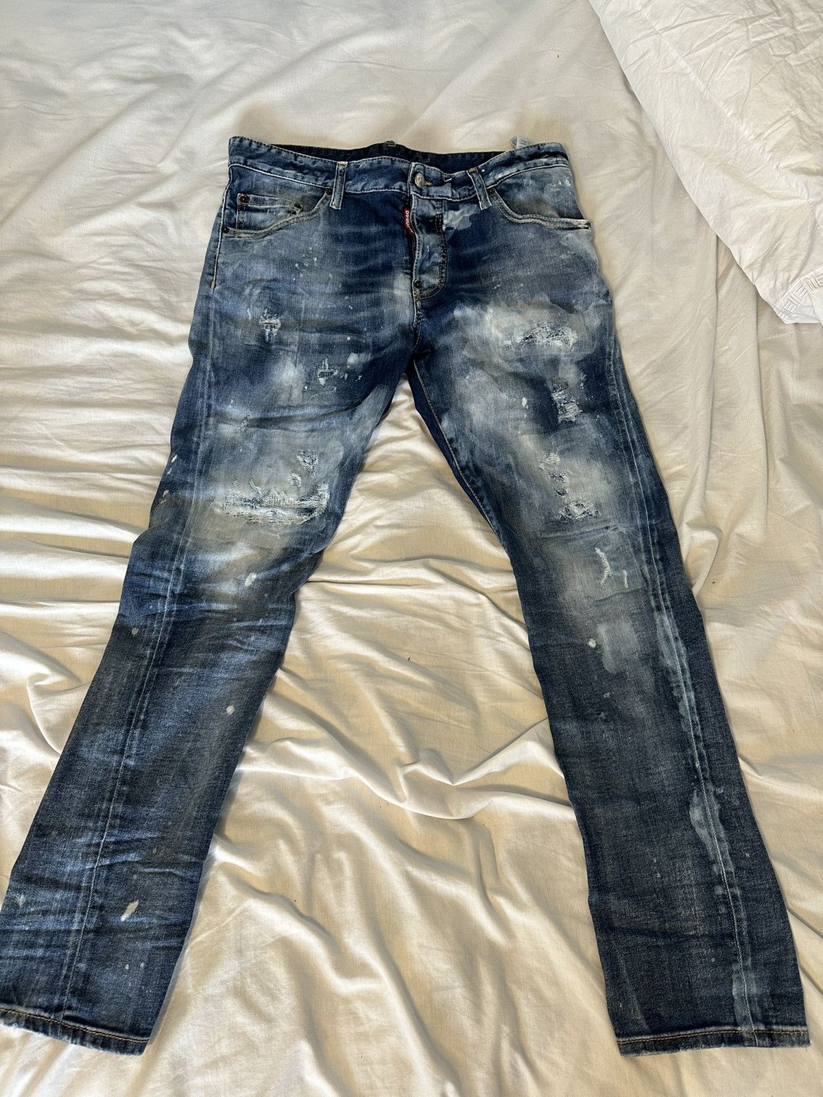 Dsquared2 Dsquared blue twisted inseam paint splattered jeans | Grailed