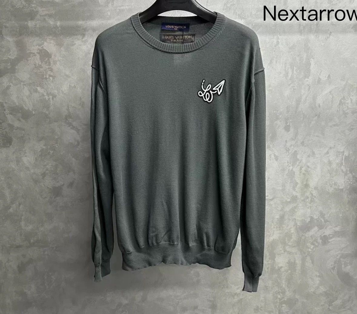 Louis Vuitton's latest grey tool logo knit sweater