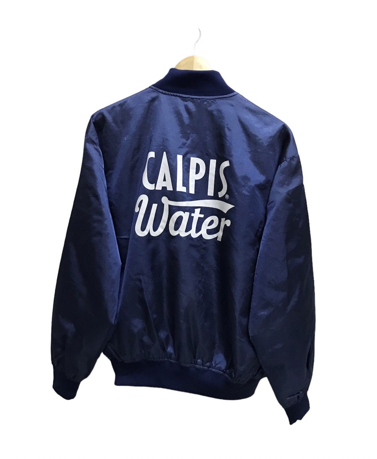 image of Vintage 80's Calpis Water Snap Button Varsity Jacket in Blue, Men's (Size Large)