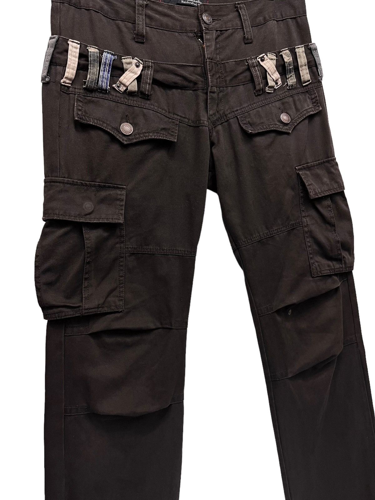 image of Fragment Design x Jun Takahashi Dominate Japanese Handcrafted Double Waist Bush Cargo Pants in Dark