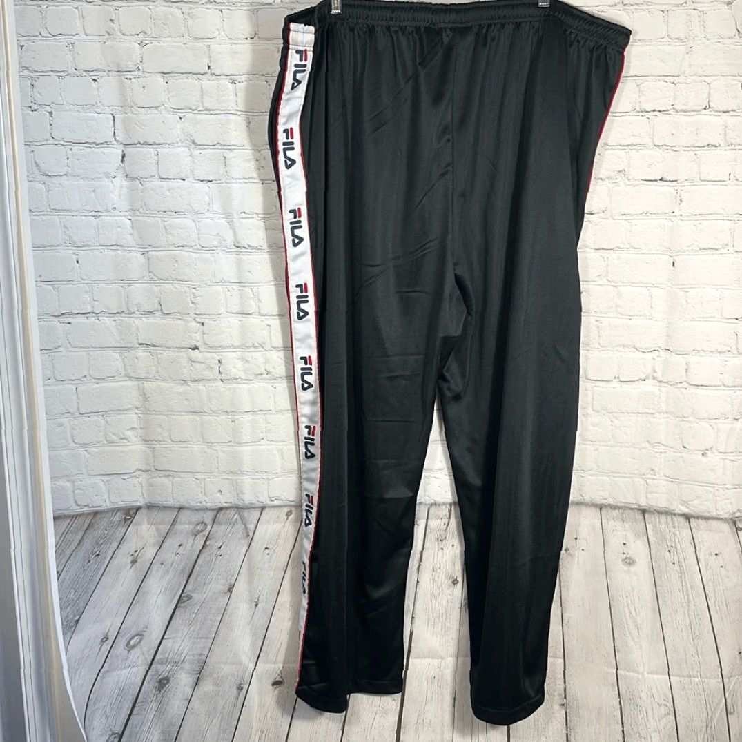 Fila VINTAGE Fila Track Pants Men’s 4XL Black Tapered Logo on Sides Polyester Track Pants Mens 4XL Black 90s Activewear Size US 39 - 7 Thumbnail