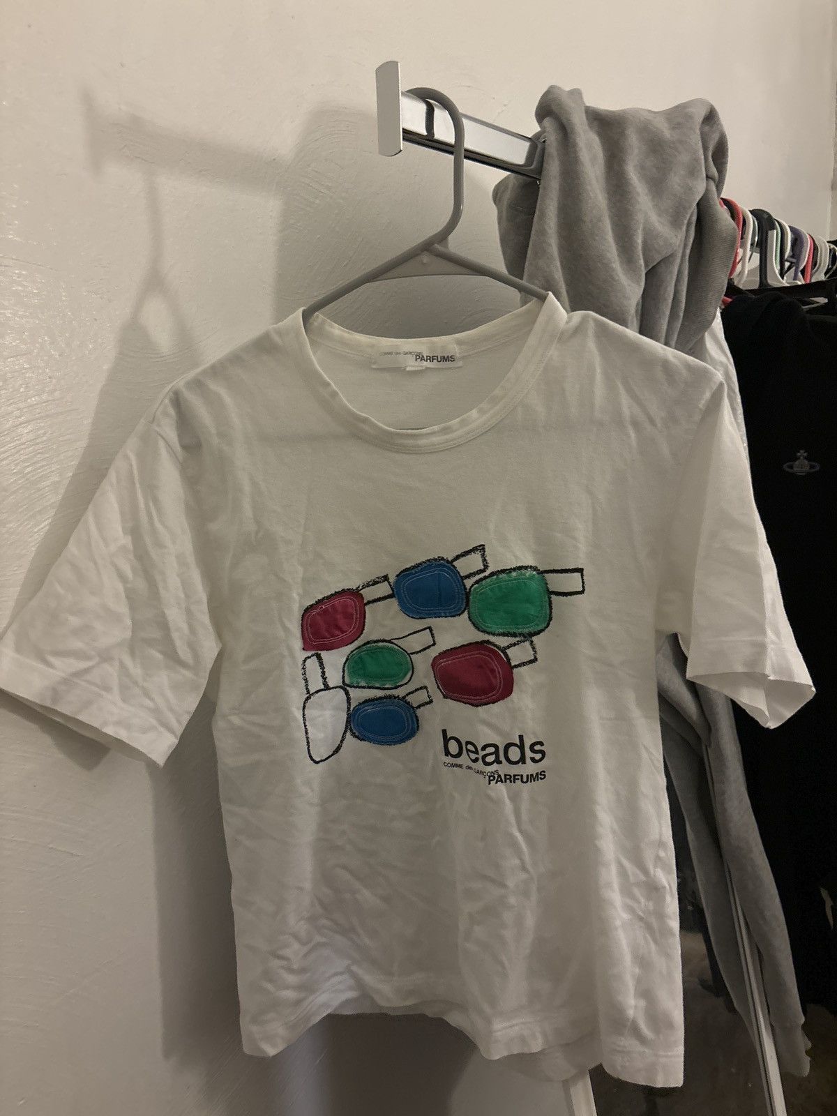 image of Comme Des Garcons Parfums “Beads” Commes Des Garçons Tee in White, Men's (Size Small)