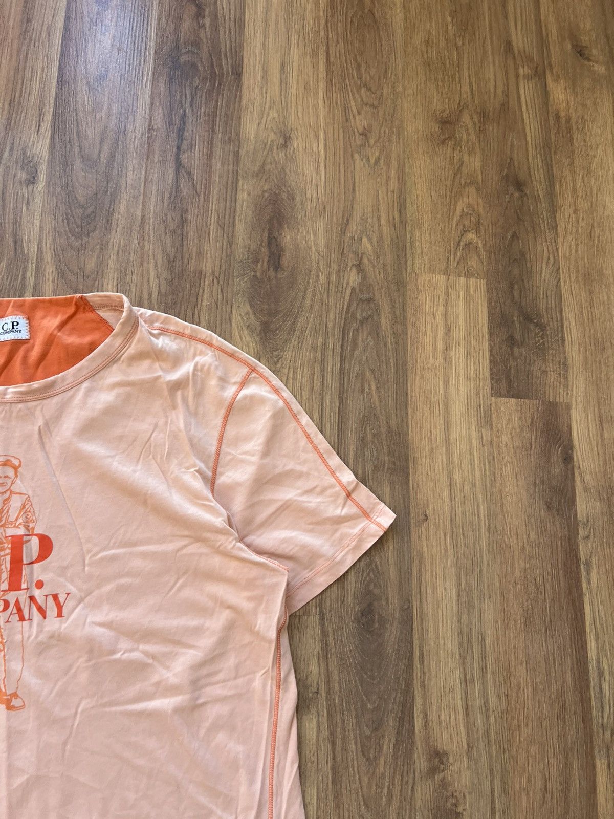 C.P. Company C.P. Company Graphic Logo T-Shirt — Light Peach / Size M Size US M / EU 48-50 / 2 - 3 Thumbnail