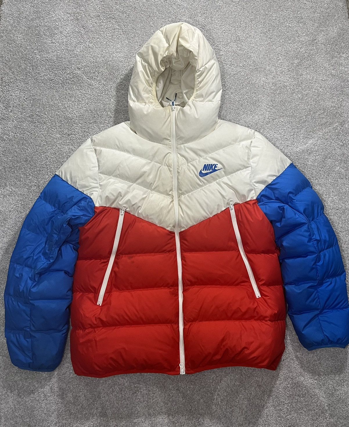 image of Nike Windrunner Puffer Coat in Orange/Blue/White, Men's (Size XL)