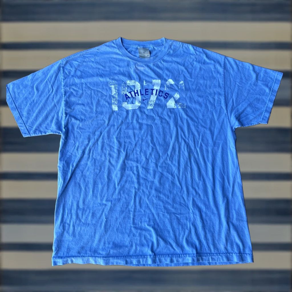 Nike VINTAGE Nike Athletic Center Swoosh Essential T-Shirt 2XL Shirt Adult 2XL Blue Nike 90s Graphic Print Mens Womens Size US XXL / EU 58 / 5 - 1 Thumbnail