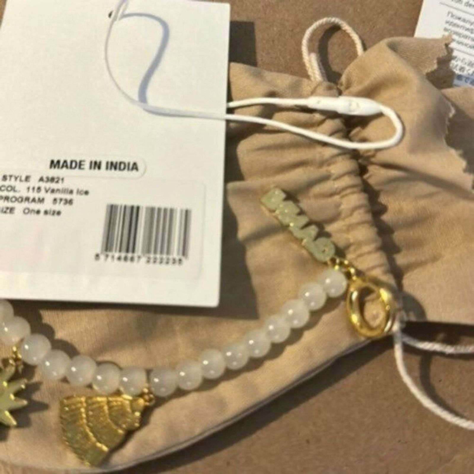 Ganni Ganni White beaded bracelet with gold charms Size ONE SIZE - 7 Thumbnail