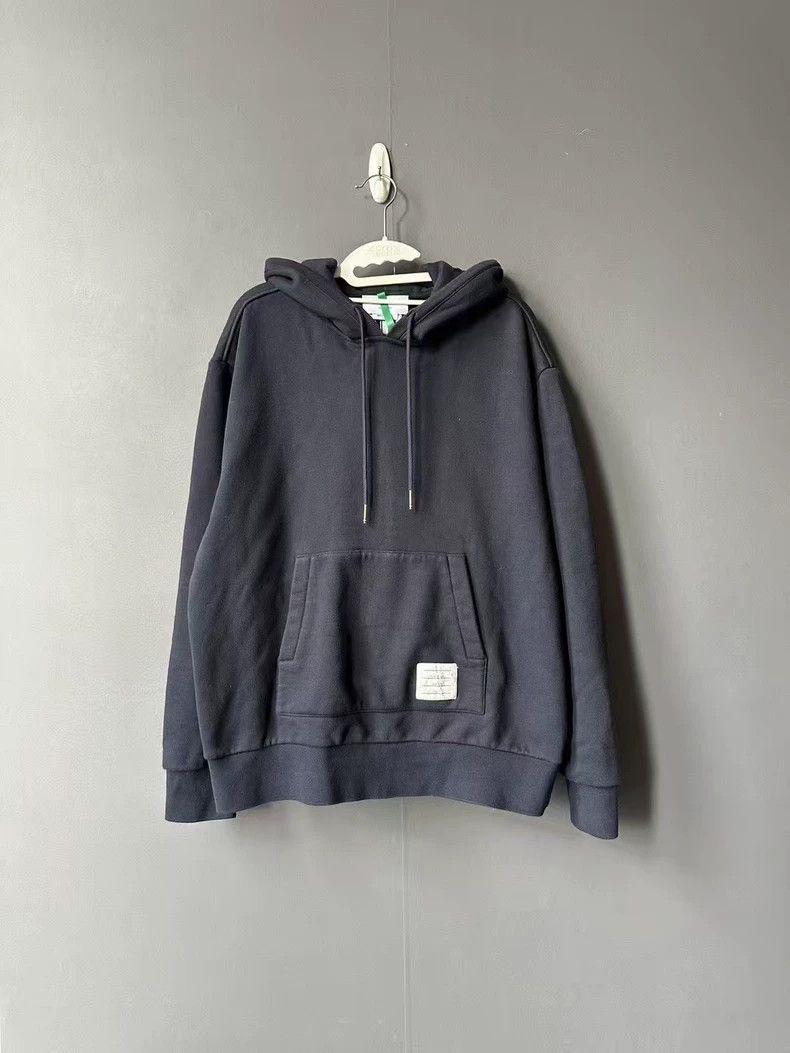 Thom Browne A striped cap shirt behind it