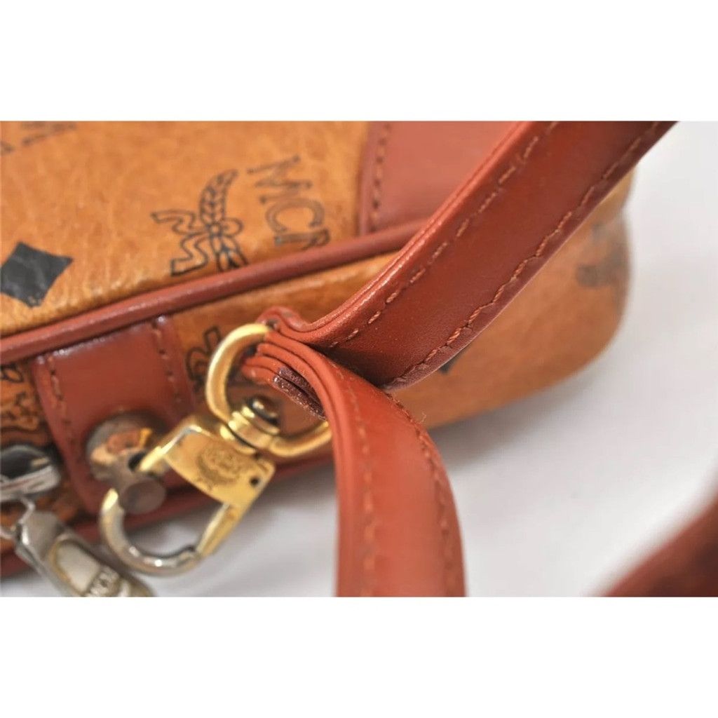 MCM MCM Brown Clutch with Logo Pattern and Wrist Strap Size ONE SIZE - 8 Thumbnail