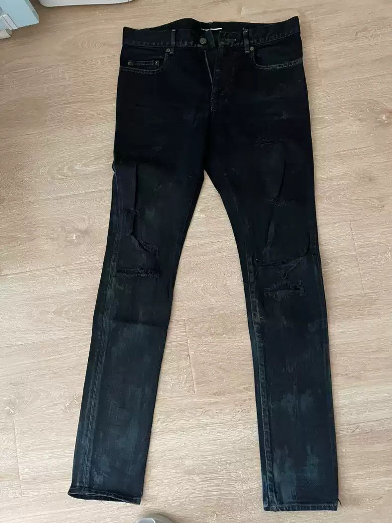 Saint Laurent Oil stains damage jeans greatly