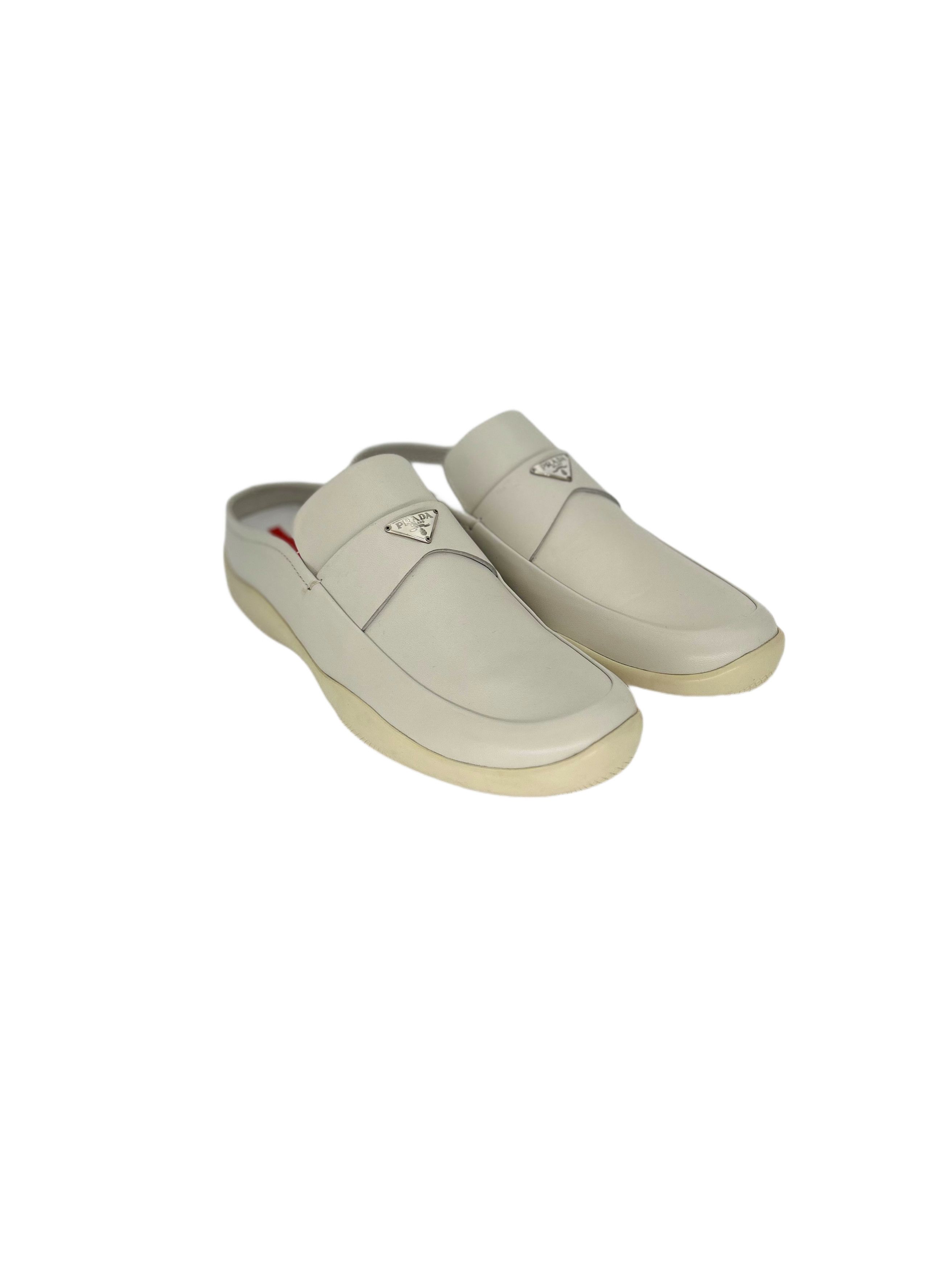Prada Linea Rossa White Mules With Metal Logo