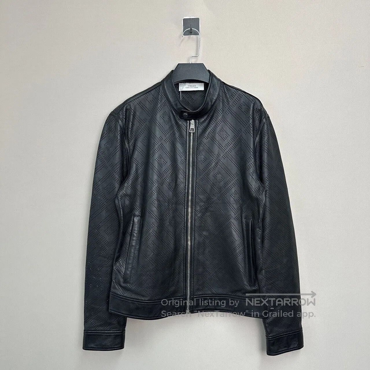 black perforated leather jacket by Versace.