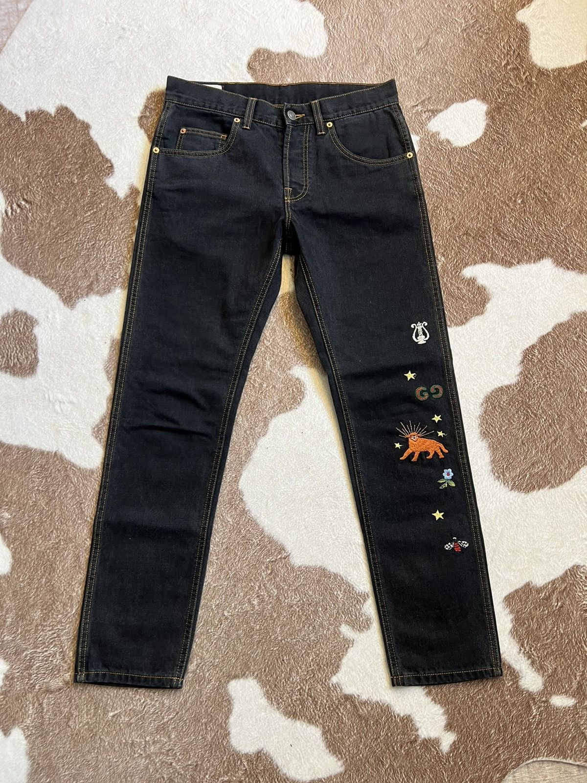 black embroidered gucci jeans
