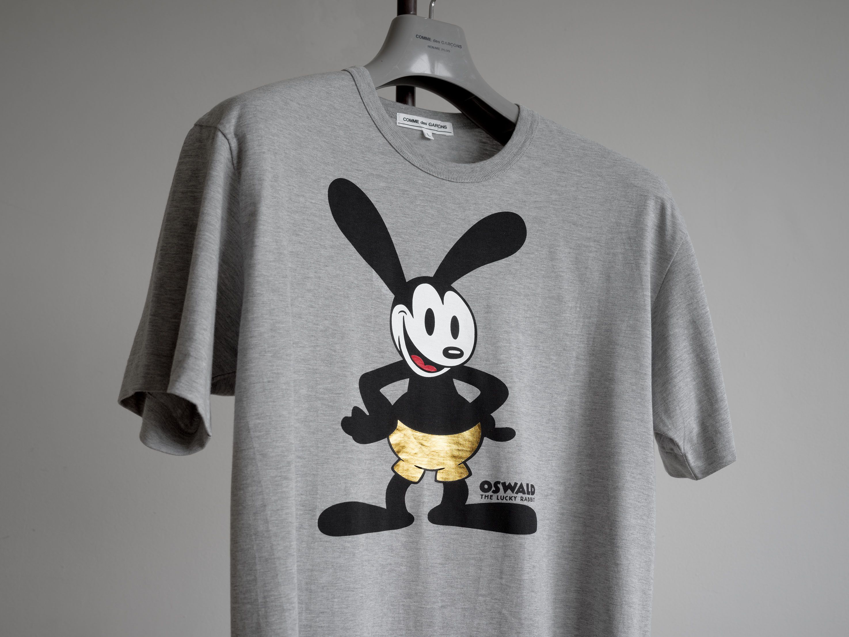 COMME des GARCONS Oswald Tシャツ グレー　ディズニー Comme des Garcons CDG x Disney Mickey Mouse T-Shirt | Grailed
