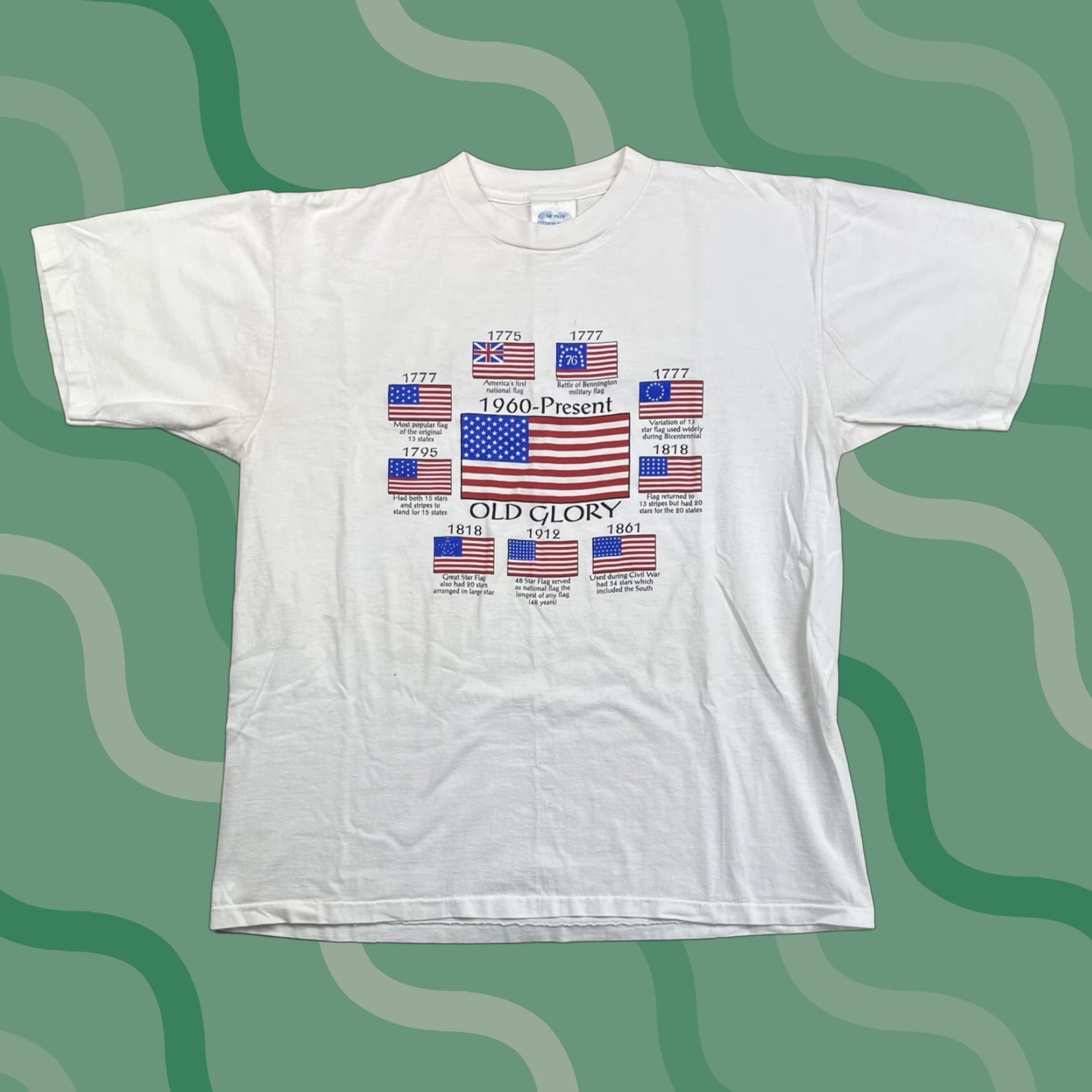 Vintage VINTAGE Le Pays International T-Shirt American Flag Graphic XL White Short Sleeve 90s Unisex Adults Size US XL / EU 56 / 4 - 1 Thumbnail