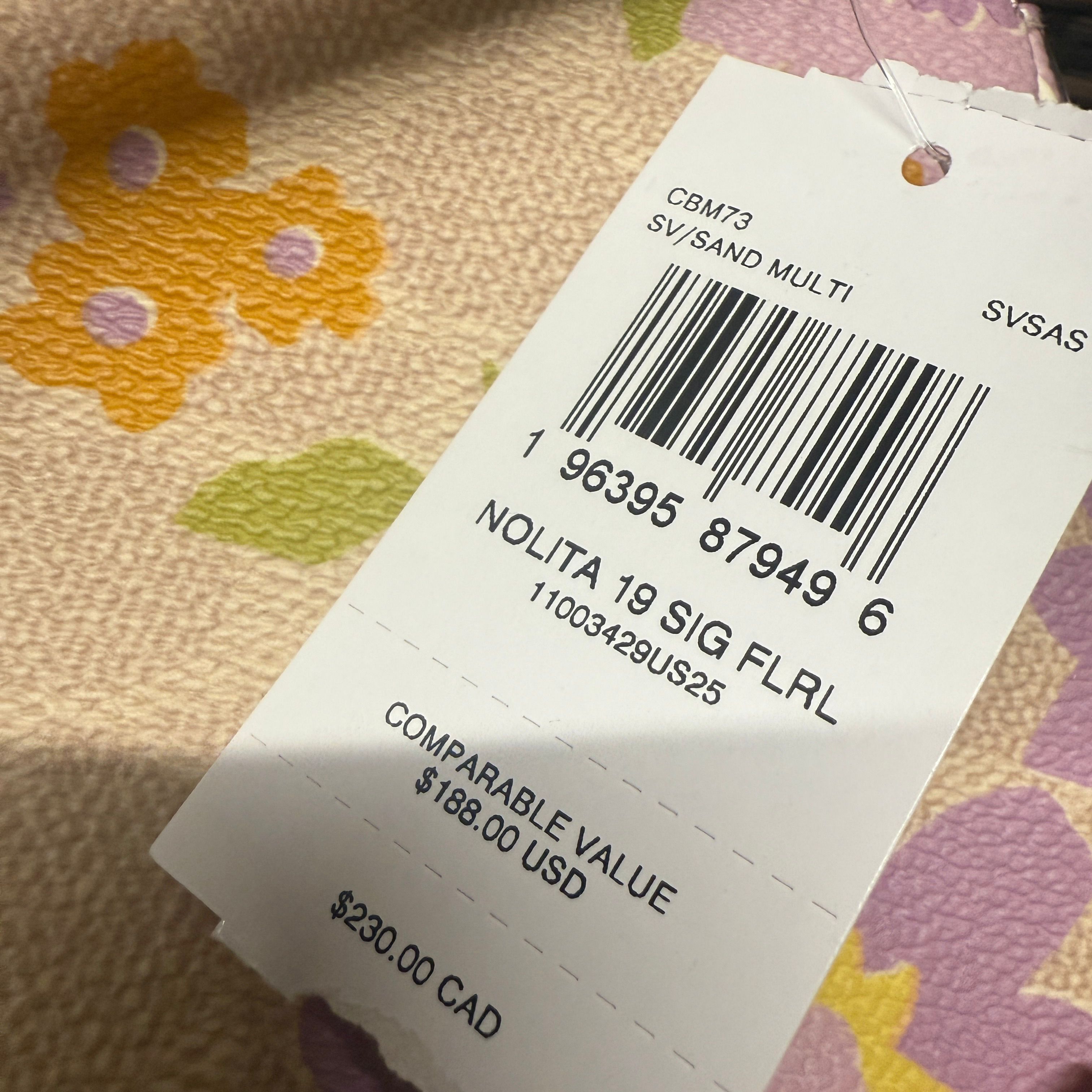 coach Nolita 19 In Signature Canvas With Floral Print cbm73