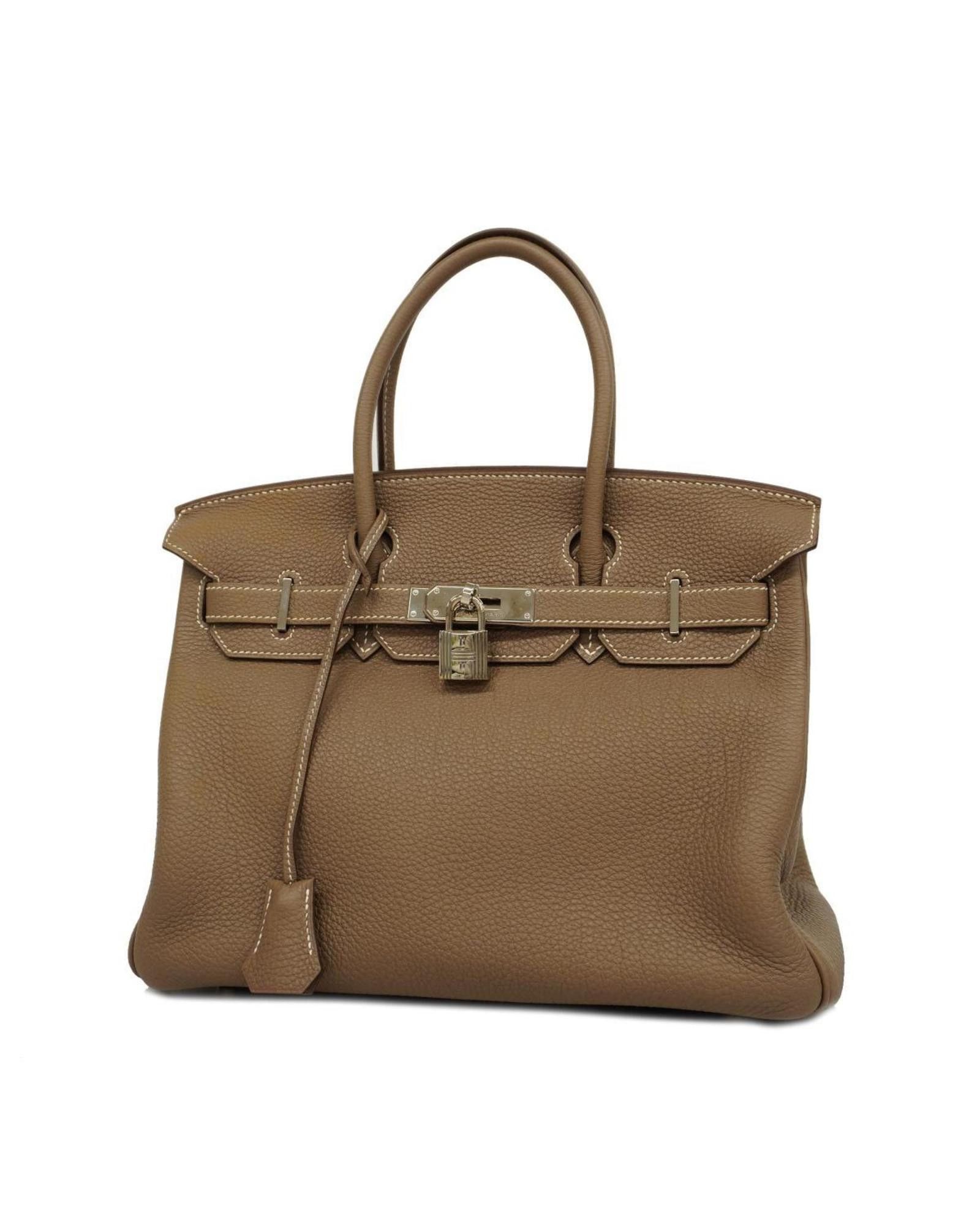 image of Hermes Elegant Brown Leather Handbag With Accessories, Women's