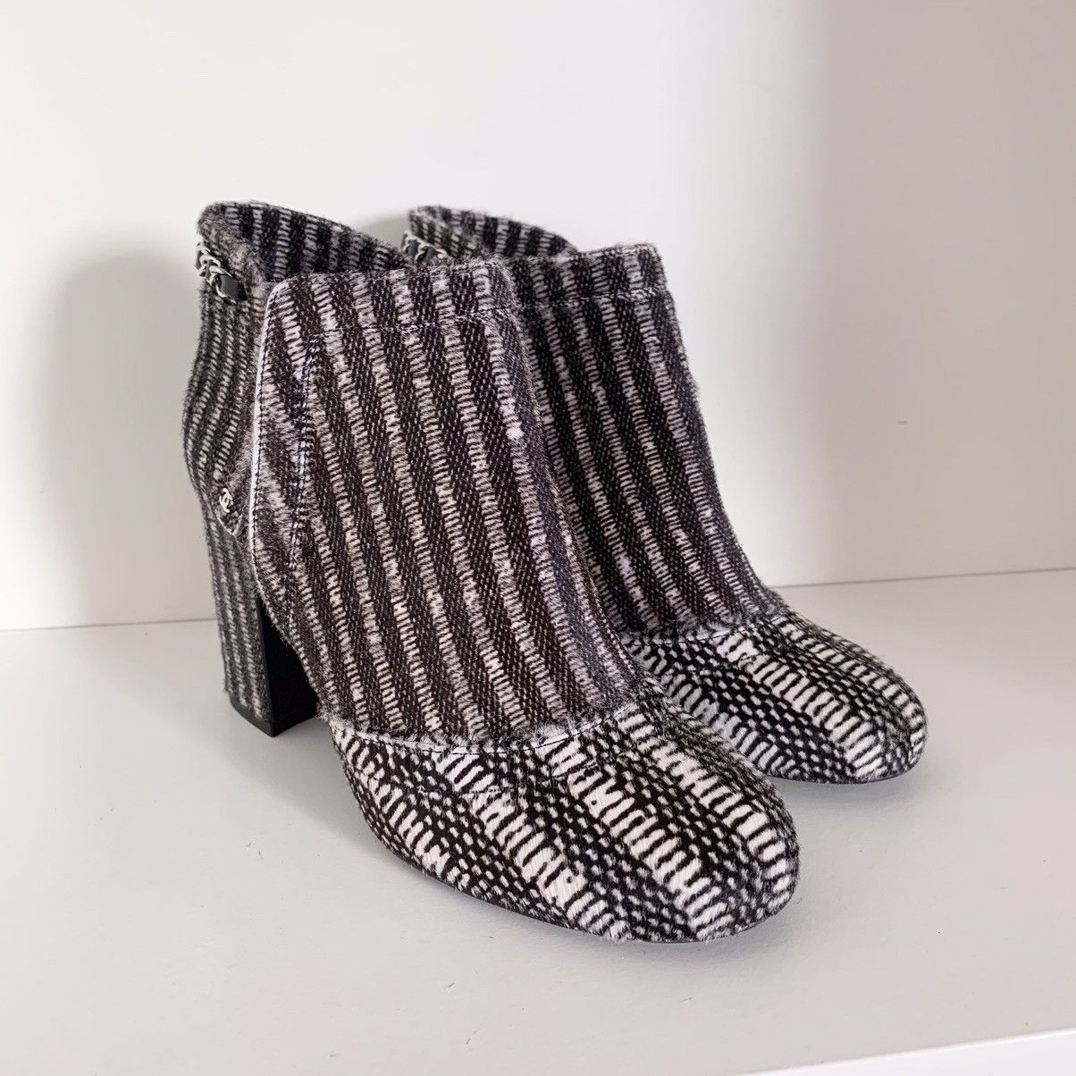 Pony hair chain logo zipper heeled boots $2100