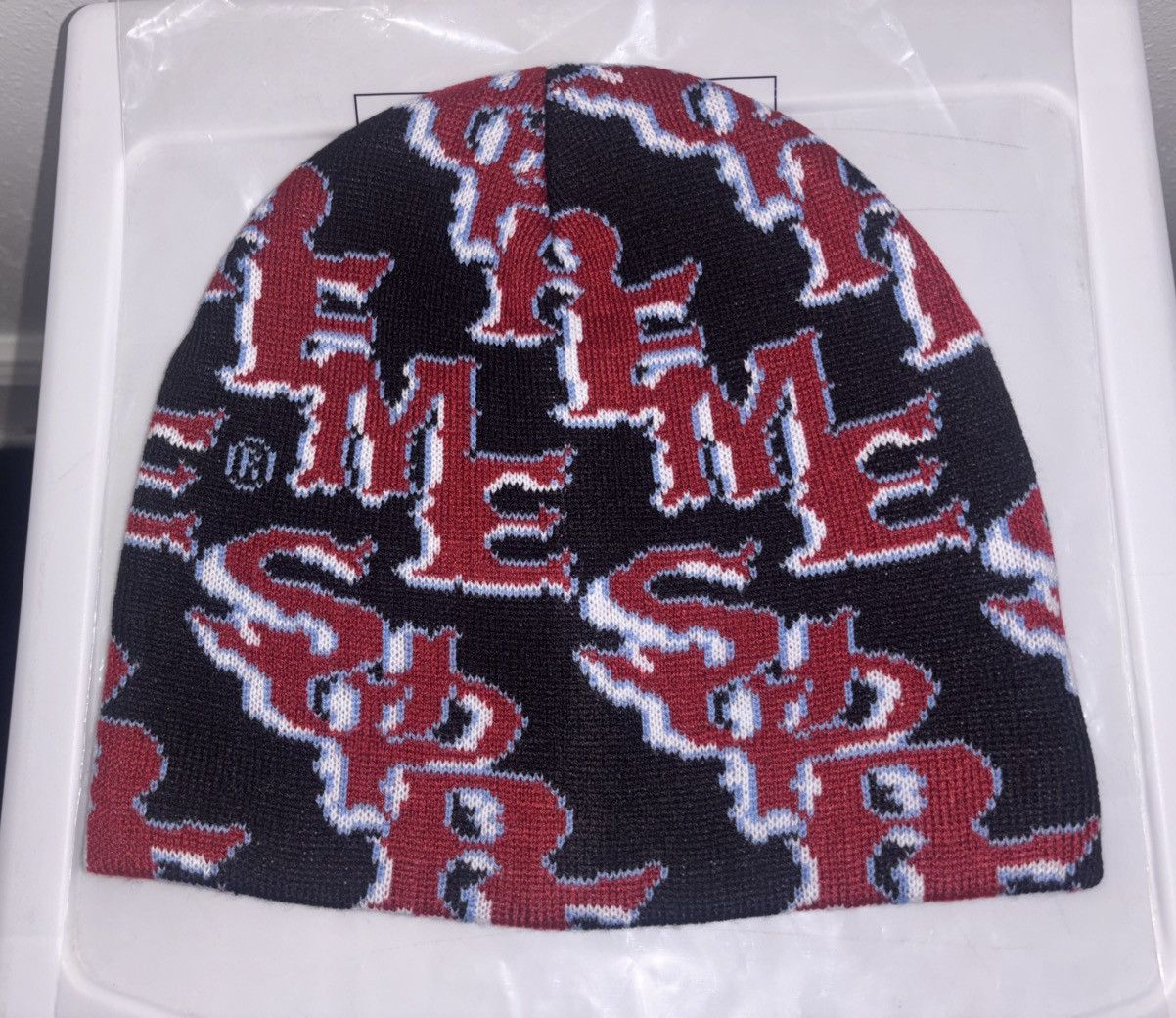 Supreme Slanted Gothic Outline Beanie Black in Hand