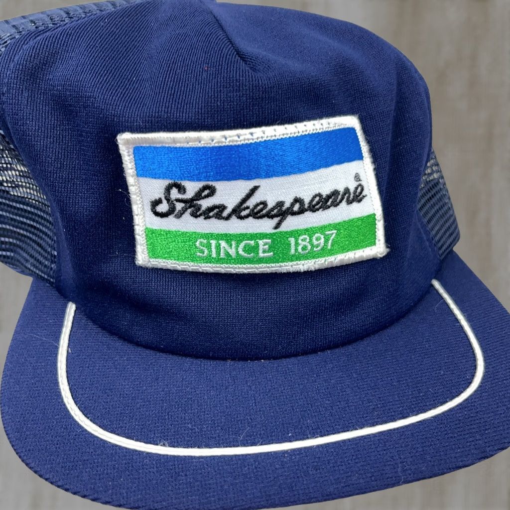 Vintage VINTAGE Shakespeare Reels Patch Trucker Hat Cap Snapback Made In USA 80s Blue Adjustable Men Hat Size ONE SIZE - 1 Thumbnail