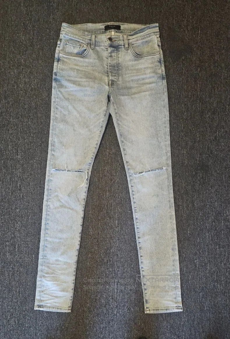 Amiri Distressed Denim Jeans.