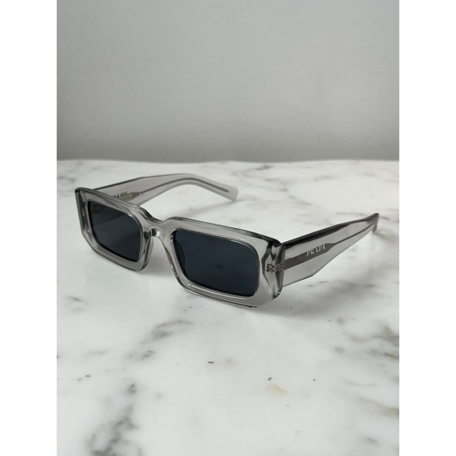 Prada NEW Prada PR06YS Sunglasses in Transparent Grey Size ONE SIZE - 1 Thumbnail