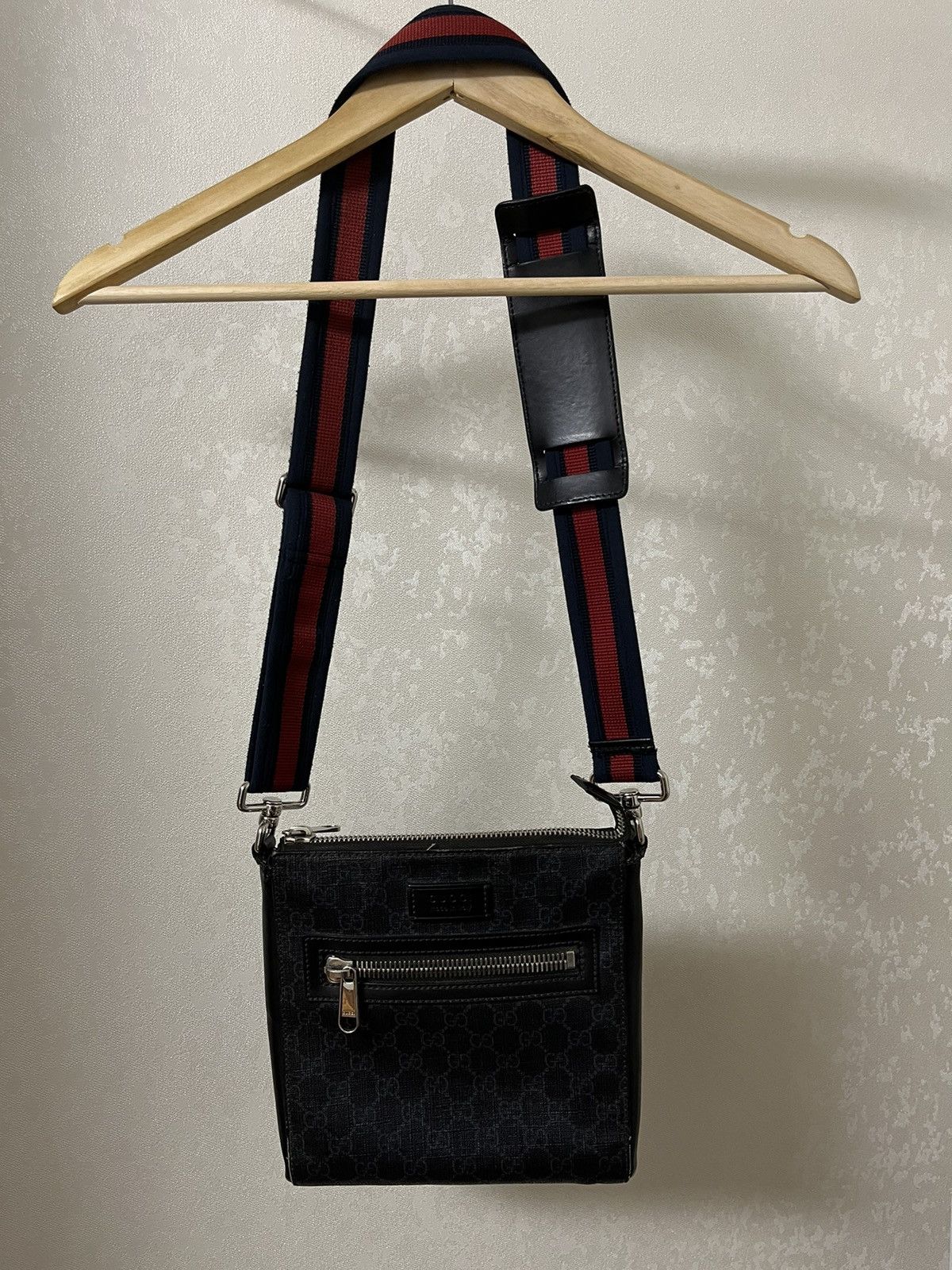 image of Gucci GG Supreme Monogrammed Messenger in Black, Men's