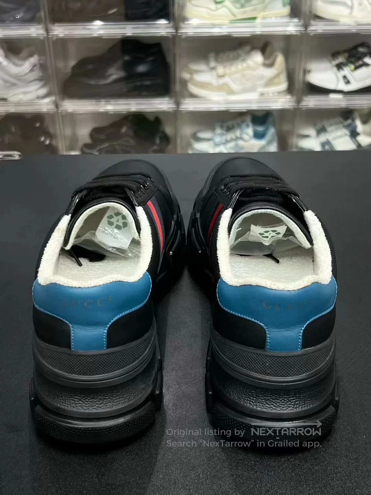 Black Low-Top Sneakers with Red and Blue Stripes.