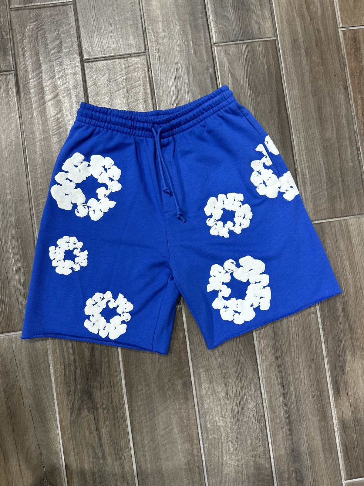 DENIM TEARS Denim Tears Cotton Wreath Blue Sweat Shorts | Grailed